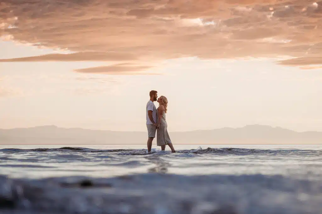 a newly engaged couple plays in the water in sechelt on the sunshine coast of bc with wedding photographer fresh air photographer