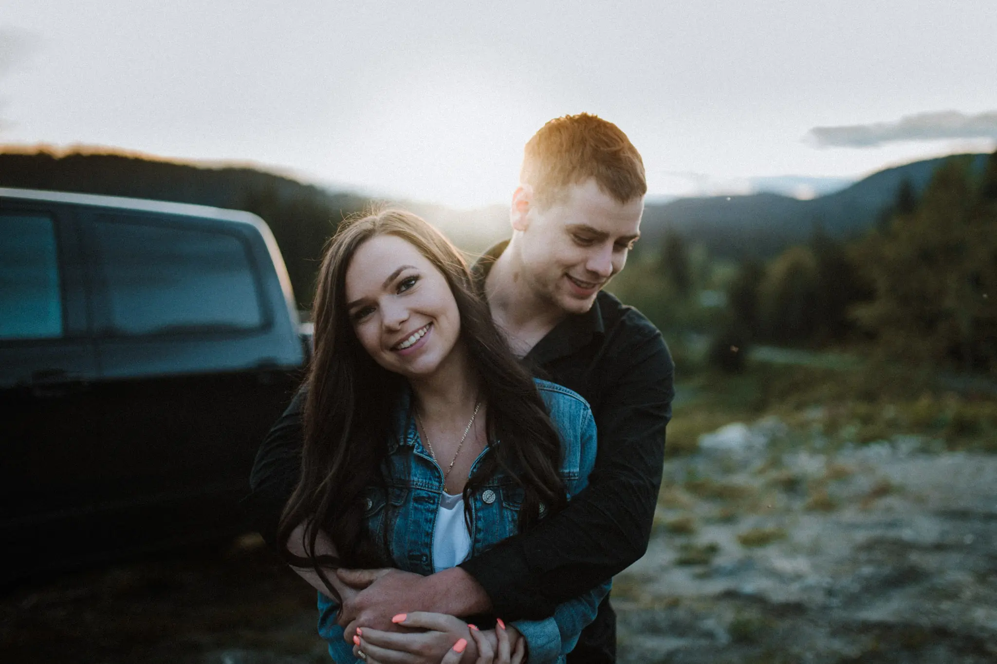 young couple hugging at sunset mini session