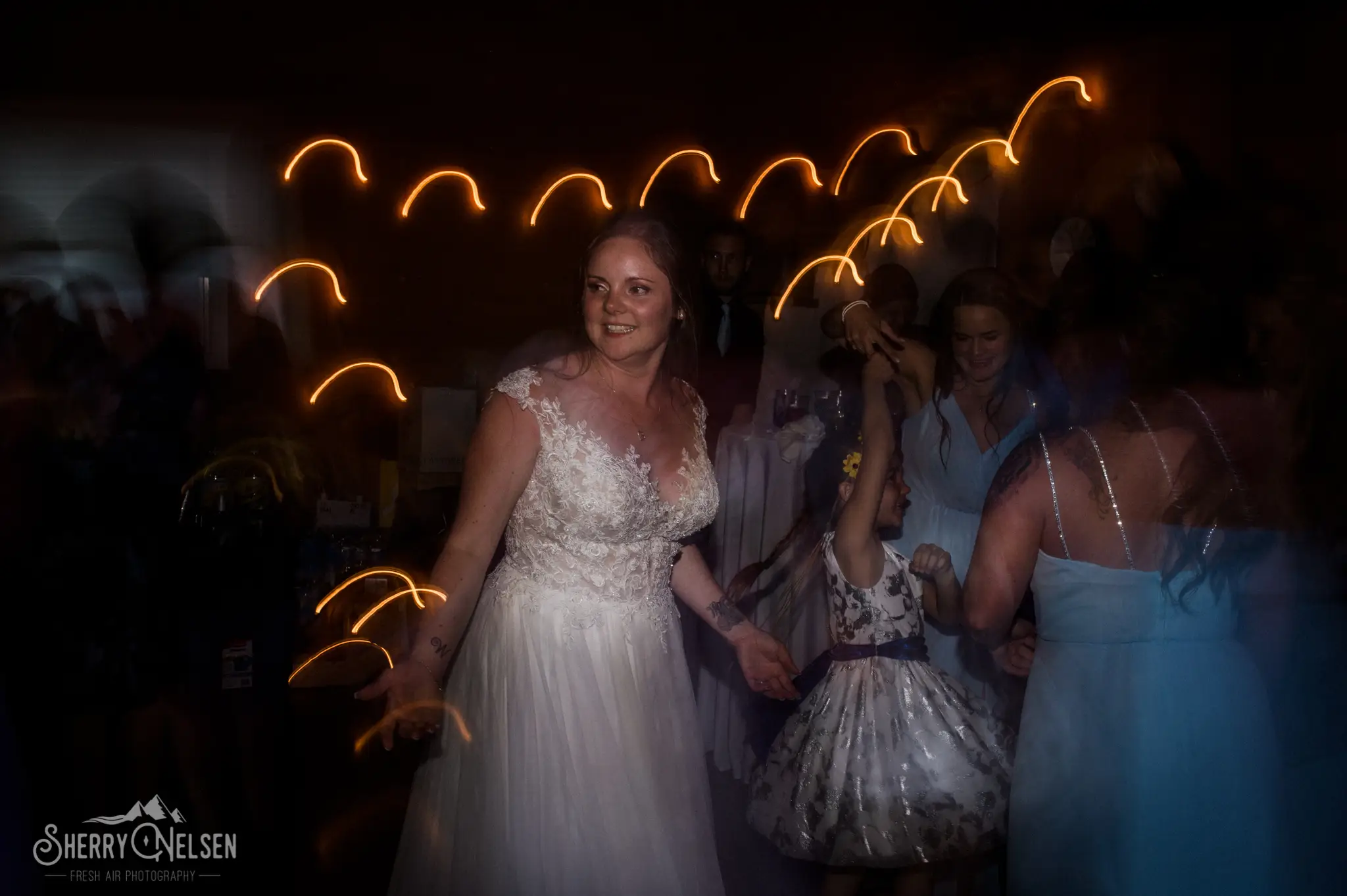 the bride enjoying visiting with friends and family at her Sechelt BC Wedding