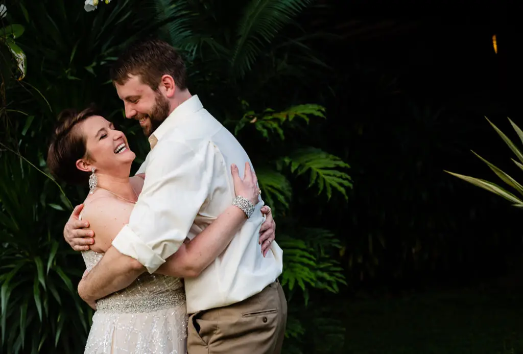 bride and groom laugh in Bali