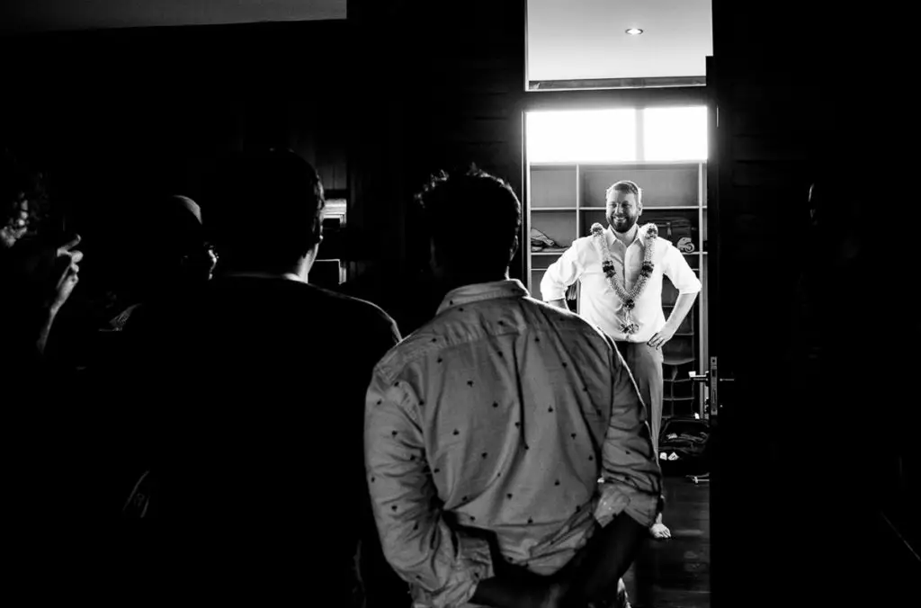 Groom poses for photos in Bali