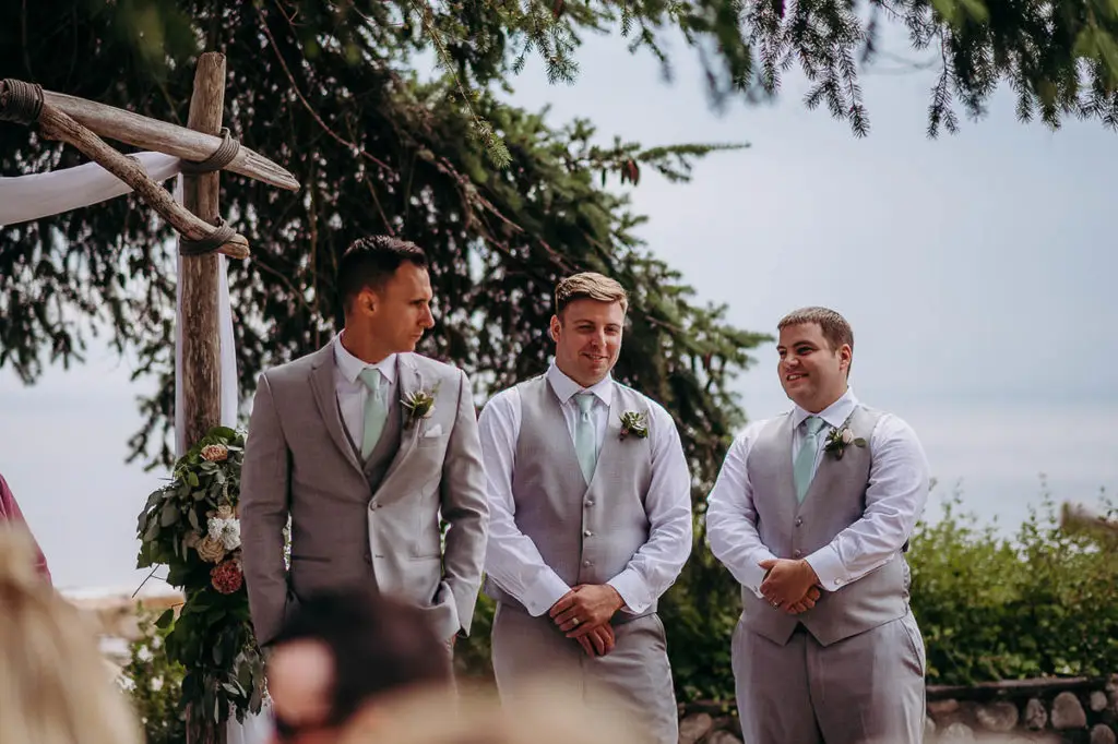 a nervous groom awaits his bride at the alter at Chaster House Gibsons BC