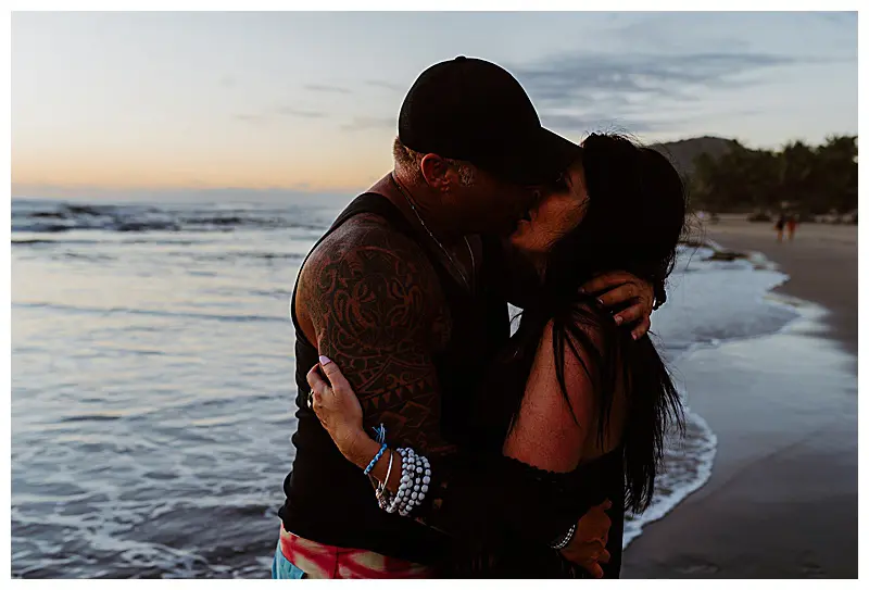 couple kissing on the beach at sunset  in Troncones