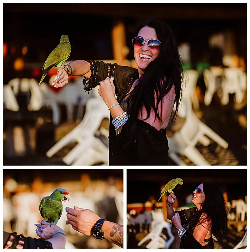 Leah smiling and a parrot on arm, one of the charming ways locals make money on the beach in Troncones Mexico