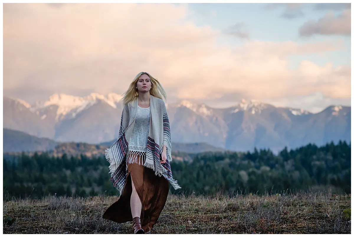 Girl walking in the mountains at sunset