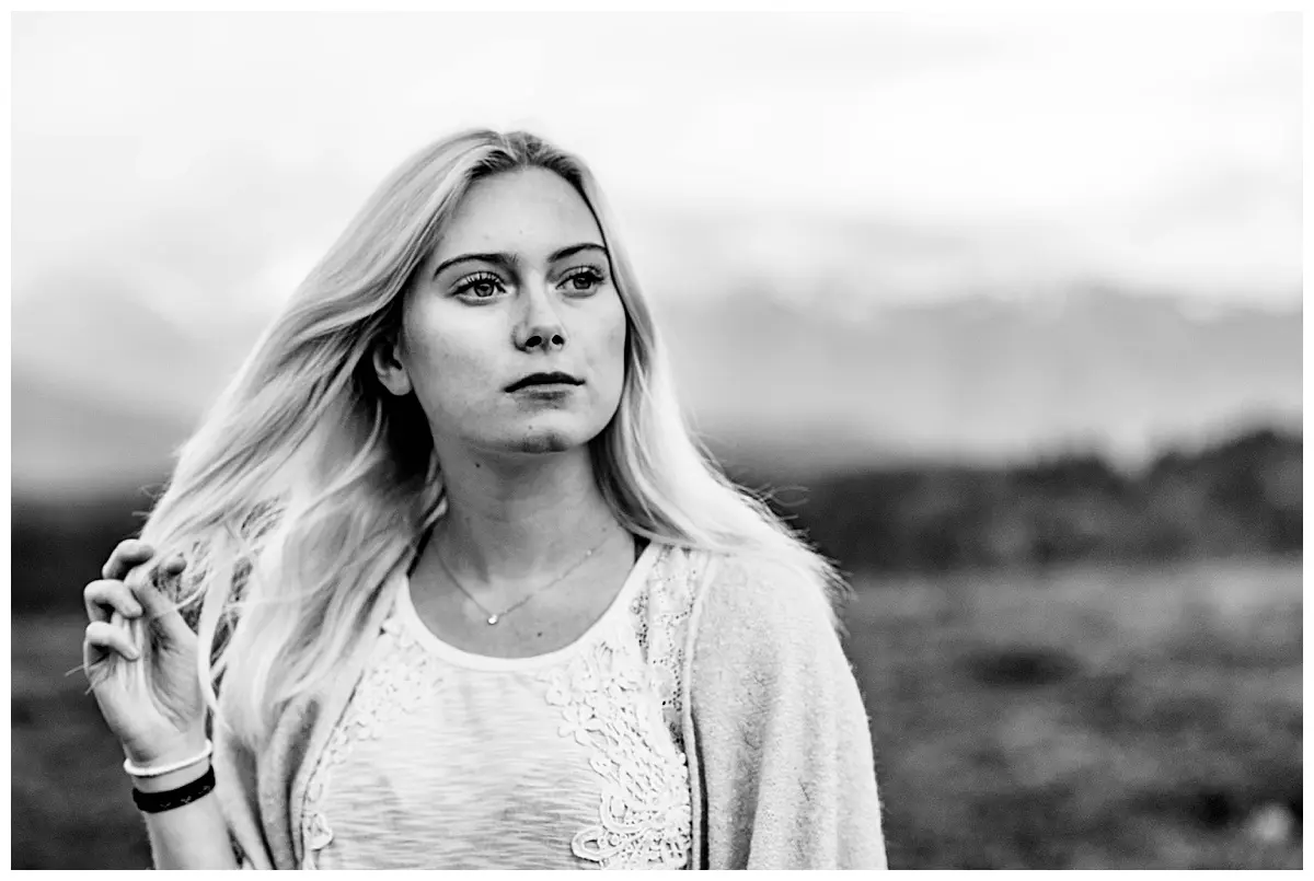 Girl walking in the mountains at sunset