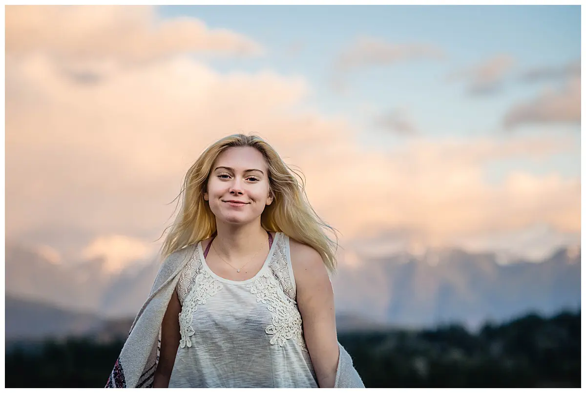 Ashley smiles as she enjoys a mountain adventure photo session