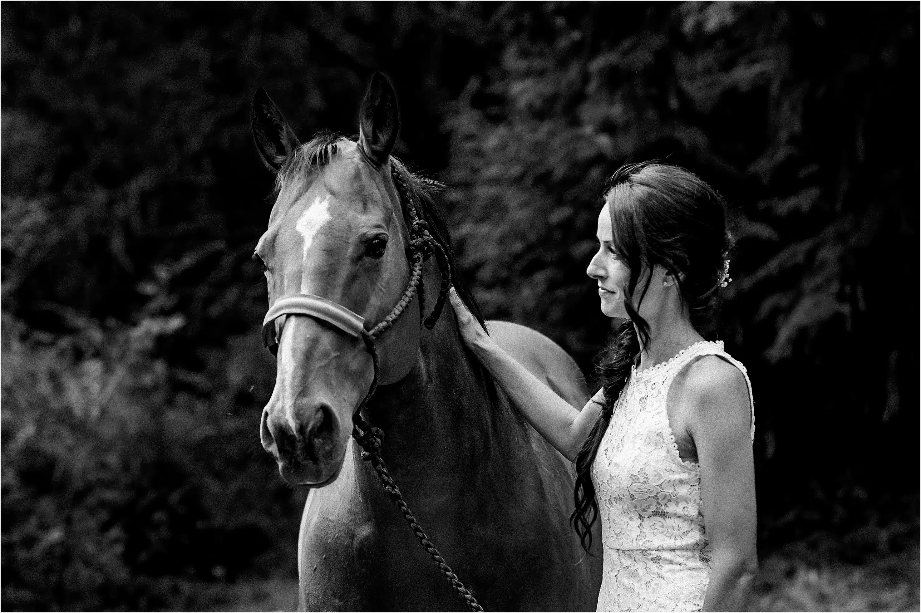 a bride shares a cute moment with her horse during her wedding in parksville bc that had a western theme